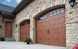 A garage door in need of repair in Naperville, IL